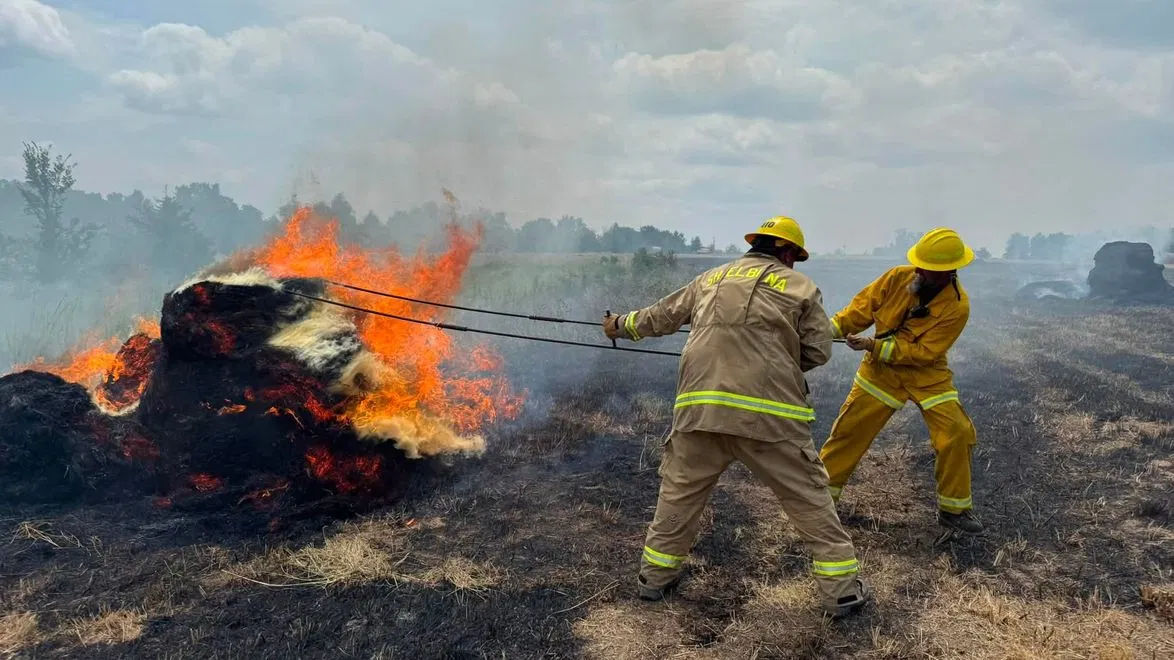 Fire Crews Fight Blazing Field, Hay Baler in Shelby County